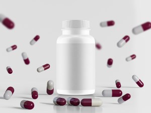 White bottle for Private Label Vitamin Supplement surrounded by red and white capsules – clean and minimal product mockup on a light background for supplement branding.