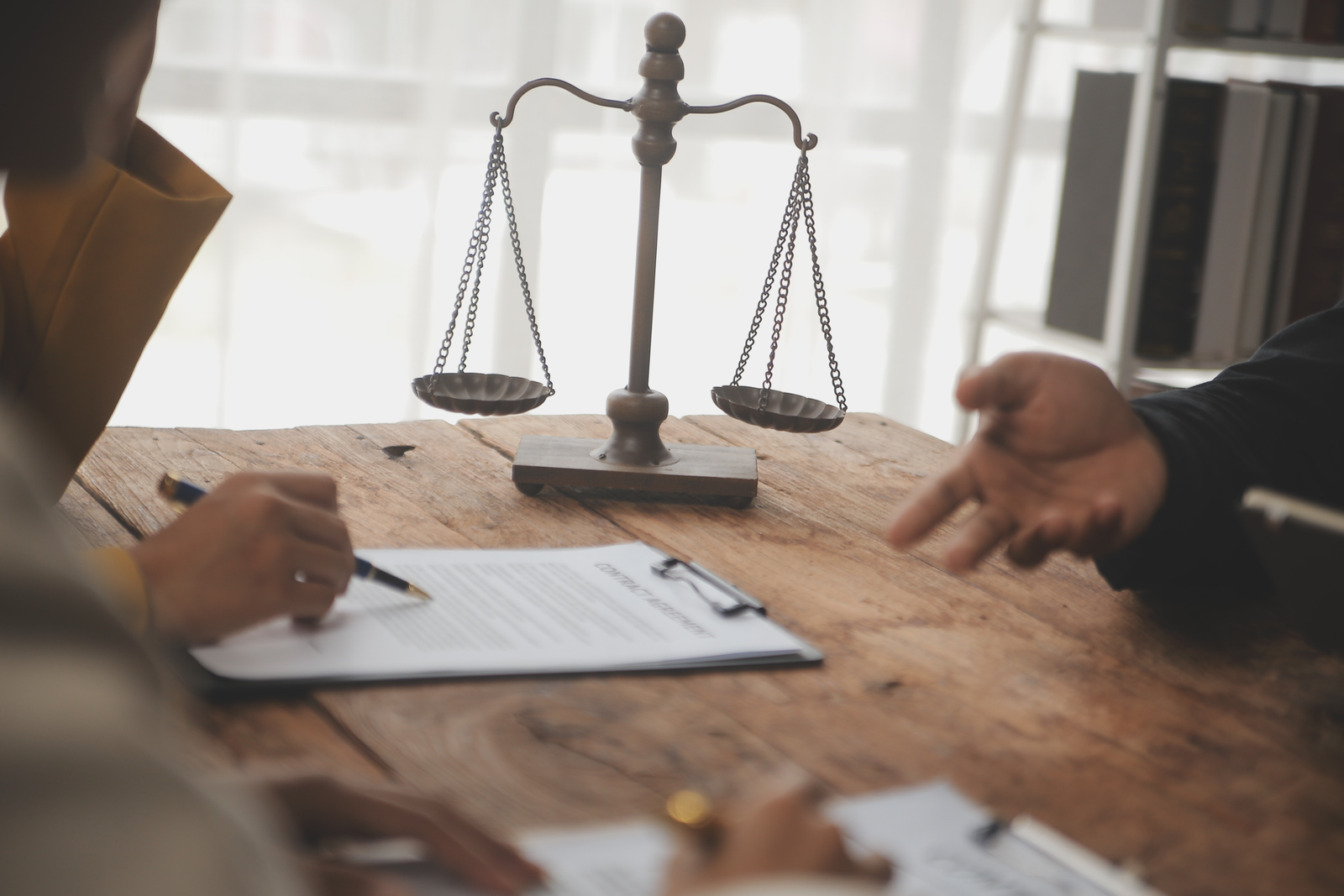 Business and lawyers discussing contract papers and DMAA Legality for supplement manufacturers with brass scale on desk in office. Law, legal services, advice, justice and law concept picture with film grain effect