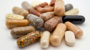 A variety of colorful capsules and tablets representing high-quality vitamins manufactured in USA. Showcases the diversity of made in USA vitamins and supplements, highlighting premium vitamins made in the USA.