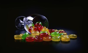 Gummy manufacturing problems are not present as gummies are falling from a glass